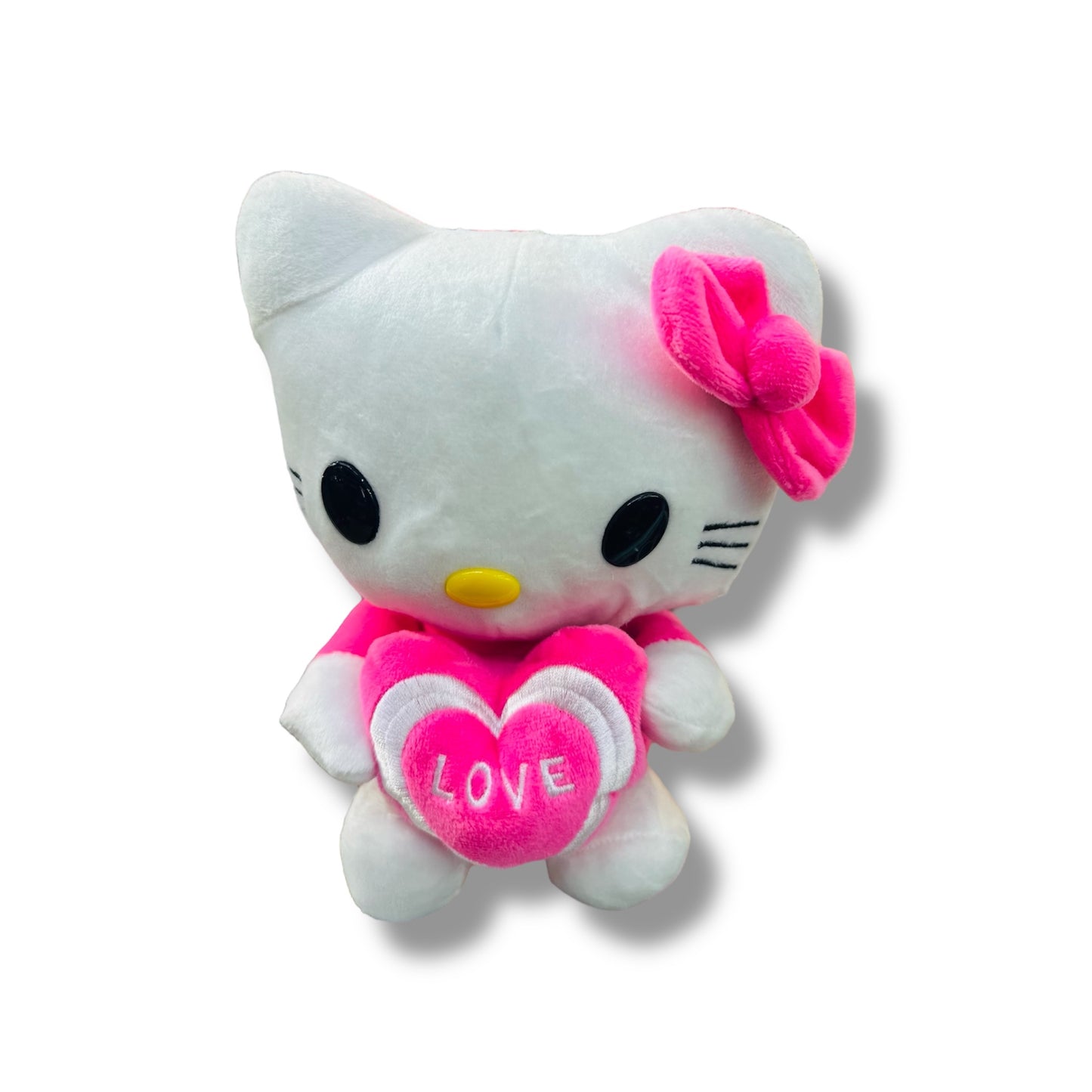 PELUCHE DE HELLO KITTY CON UN CORAZÓN ROSADO - 23 CM APROX